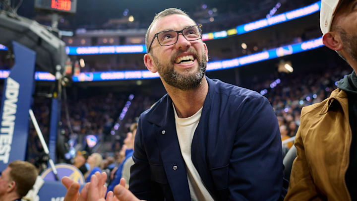 Dec 12, 2025; San Francisco, California, USA; General manager of the Stanford Cardinal football program Andrew Luck looks on during the first quarter of the game between the Golden State Warriors and the Minnesota Timberwolves at Chase Center. Mandatory Credit: Robert Edwards-Imagn Images