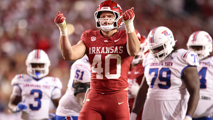 Arkansas Razorbacks DE Landon Jackson celebrates after sacking Louisiana Tech Bulldogs quarterback Evan Bullock.