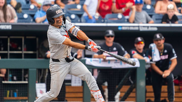 Jun 17, 2025; Omaha, Neb, USA; Oregon State Beavers second baseman AJ Singer (7) hits a single against the Louisville Cardinals during the ninth inning at Charles Schwab Field. Mandatory Credit: Dylan Widger-Imagn Images