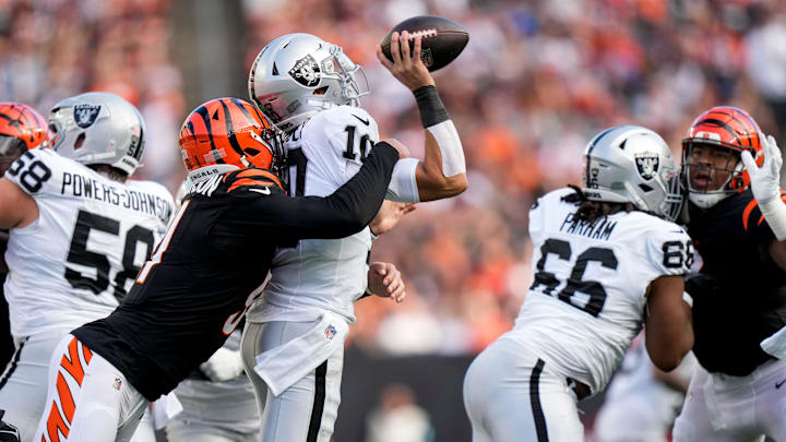 Cincinnati Bengals defensive end Trey Hendrickson (91) sacks Las Vegas Raiders quarterback Desmond Ridder (10) in the third quarter of the NFL Week 9 game between the Cincinnati Bengals and the Las Vegas Raiders at Paycor Stadium in downtown Cincinnati on Sunday, Nov. 3, 2024. The Bengals collected their first win at home with a 41-24 victory over the Raiders. Cincinnati Bengals defensive end Trey Hendrickson (91) sacks Las Vegas Raiders quarterback Desmond Ridder (10) in the third quarter of the NFL Week 9 game between the Cincinnati Bengals and the Las Vegas Raiders at Paycor Stadium in downtown Cincinnati on Sunday, Nov. 3, 2024. The Bengals collected their first win at home with a 41-24 victory over the Raiders.