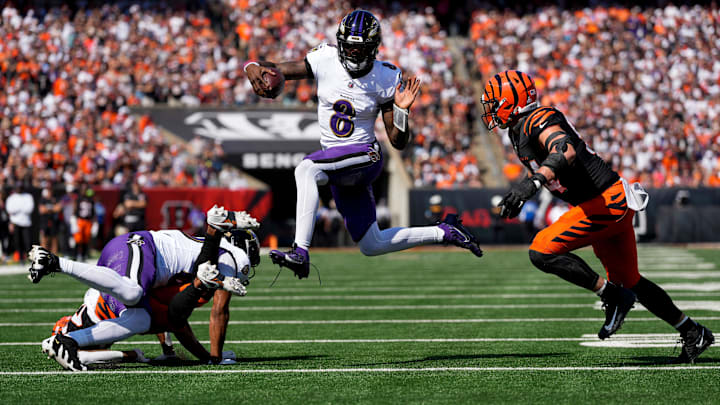 Baltimore Ravens quarterback Lamar Jackson (8) leaps away from Cincinnati Bengals defensive end Sam Hubbard (94) on a keeper in the first quarter of the NFL Week 5 game between the Cincinnati Bengals and Baltimore Ravens at Paycor Stadium in downtown Cincinnati on Sunday, Oct. 6, 2024. The Bengals led 17-14 at halftime. Baltimore Ravens quarterback Lamar Jackson (8) leaps away from Cincinnati Bengals defensive end Sam Hubbard (94) on a keeper in the first quarter of the NFL Week 5 game between the Cincinnati Bengals and Baltimore Ravens at Paycor Stadium in downtown Cincinnati on Sunday, Oct. 6, 2024. The Bengals led 17-14 at halftime.