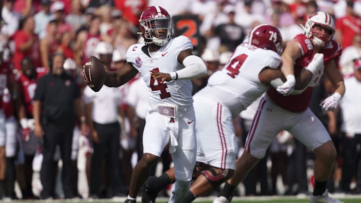 Sep 14, 2024; Madison, Wisconsin, USA;  Alabama Crimson Tide quarterback Jalen Milroe (4) throws a pass during the first quarter against the Wisconsin Badgers at Camp Randall Stadium. Mandatory Credit: Jeff Hanisch-Imagn Images