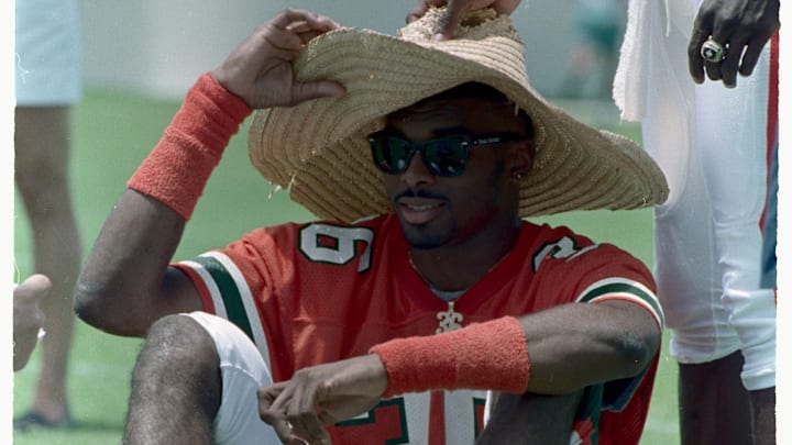 Lamar Thomas Holding Onto Hat