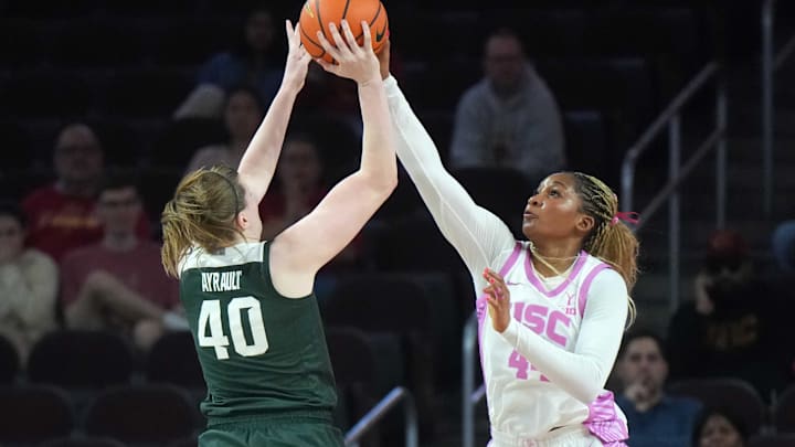 Feb 19, 2025; Los Angeles, California, USA; Southern California Trojans forward Kiki Iriafen (44) blocks a shot by Michigan State Spartans guard Julia Ayrault (40) in the first half at Galen Center. Mandatory Credit: Kirby Lee-Imagn Images Feb 19, 2025; Los Angeles, California, USA; Southern California Trojans forward Kiki Iriafen (44) blocks a shot by Michigan State Spartans guard Julia Ayrault (40) in the first half at Galen Center. Mandatory Credit: Kirby Lee-Imagn Images