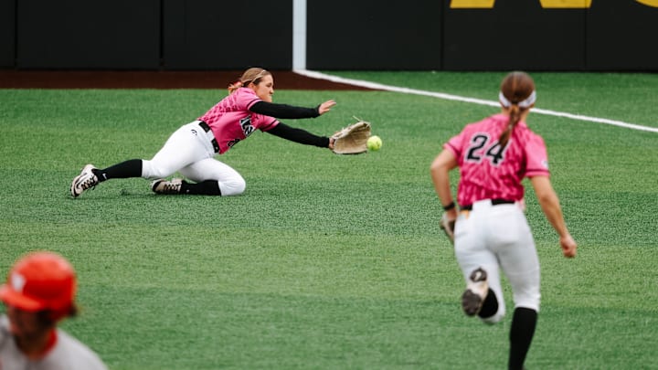 Iowa right fielder Devin Simon makes a diving attempt to catch a ball hit by Nebraska's Kacie Hoffmann during a game on April 4, 2025. Iowa right fielder Devin Simon makes a diving attempt to catch a ball hit by Nebraska's Kacie Hoffmann during a game on April 4, 2025.