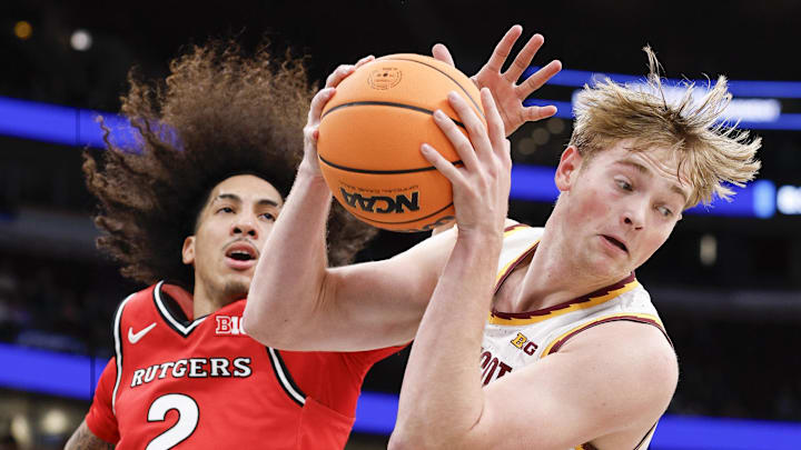 Mar 11, 2026; Chicago, IL, USA; Minnesota Golden Gophers forward Grayson Grove (2) grabs a rebound against Rutgers Scarlet Knights guard Lino Mark (2) during the first half at United Center. Mandatory Credit: Kamil Krzaczynski-Imagn Images
