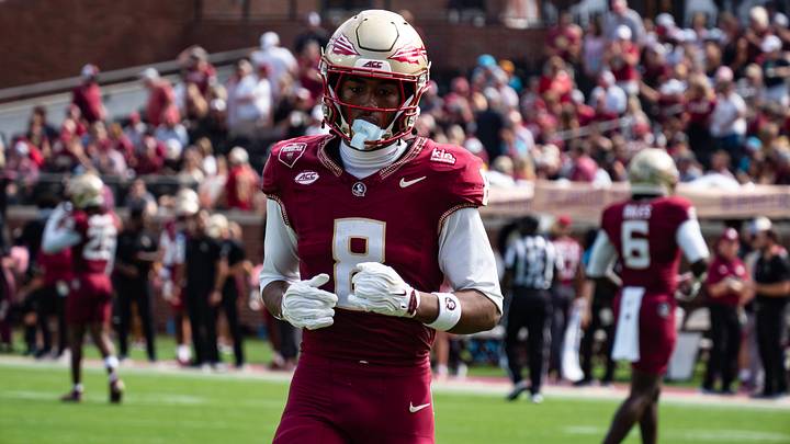Florida State quarterback Ashton Daniels makes history with five rushing touchdowns in a 38-7 victory against the Virginia Cavaliers.