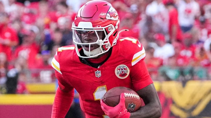 Sep 28, 2025; Kansas City, Missouri, USA; Kansas City Chiefs wide receiver Xavier Worthy (1) runs the ball against the Baltimore Ravens during the game at GEHA Field at Arrowhead Stadium.