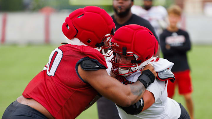 Louisville players during a rep in fall camp. Louisville players during a rep in fall camp.