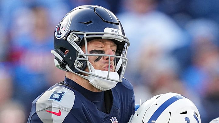 Tennessee Titans quarterback Will Levis (8) is tackled by Indianapolis Colts defensive end Samson