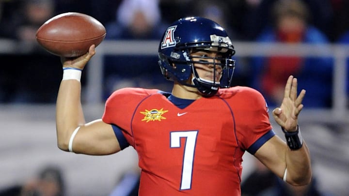 Dec 20, 2008; Las Vegas, NV, USA; Arizona Wildcats quarterback Willie Tuitama (7) throws a pass during the Wildcats' 31-21 victory over the Brigham Young Cougars in the Las Vegas Bowl at Sam Boyd Stadium. Mandatory Credit: Kirby Lee/Image of Sport-Imagn Images Dec 20, 2008; Las Vegas, NV, USA; Arizona Wildcats quarterback Willie Tuitama (7) throws a pass during the Wildcats' 31-21 victory over the Brigham Young Cougars in the Las Vegas Bowl at Sam Boyd Stadium. Mandatory Credit: Kirby Lee/Image of Sport-Imagn Images