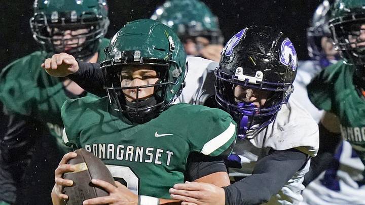 Robert Annis goes in for a tackle for the Mt. Hope varsity football team in a game against Ponagansett.