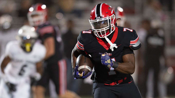Brandon's Tyson Robinson (7) carries for yardage against Oak Grove in Brandon, Miss., Friday, Oct. 18, 2024.
