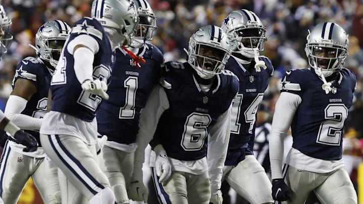 Jan 7, 2024; Landover, Maryland, USA; Dallas Cowboys safety Donovan Wilson (6) celebrates with teammates after intercepting a pass against the Washington Commanders during the second quarter at FedExField. 