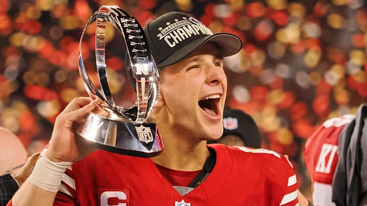 Jan 28, 2024; Santa Clara, California, USA; San Francisco 49ers quarterback Brock Purdy (13) holds the George Halas Trophy while after winning the NFC Championship football game against the Detroit Lions at Levi's Stadium. Mandatory Credit: Kelley L Cox-Imagn Images Jan 28, 2024; Santa Clara, California, USA; San Francisco 49ers quarterback Brock Purdy (13) holds the George Halas Trophy while after winning the NFC Championship football game against the Detroit Lions at Levi's Stadium. Mandatory Credit: Kelley L Cox-Imagn Images