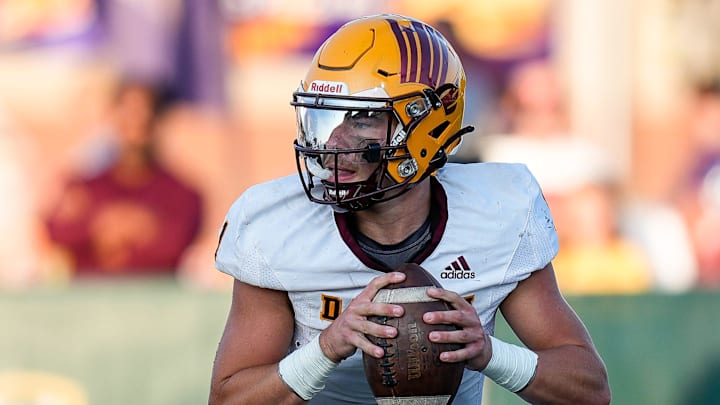 Davison quarterback Jaxson Dosh looks to pass against Warren De La Salle during first half of Prep Kickoff Classic at Wayne State's Tom Adams Field in Detroit on Thursday, August 29, 2024.