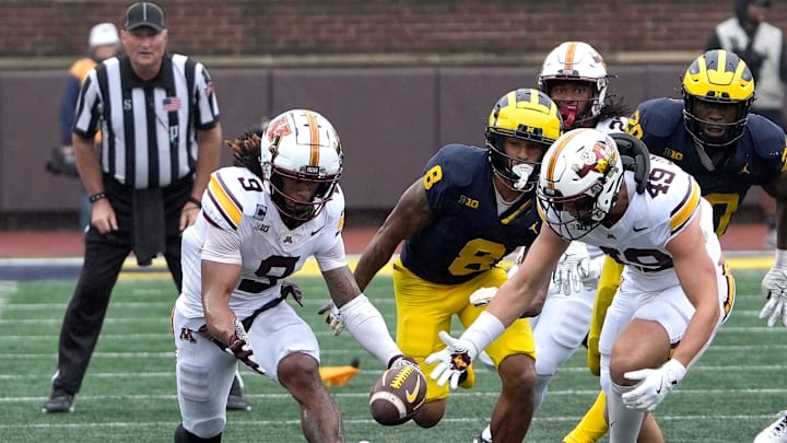 Minnesota wide receiver Daniel Jackson and linebacker Matt Kingsbury converge on the football during a onside kick that got called back because of a flag late in the fourth quarter between Michigan and Minnesota at Michigan Stadium in Ann Arbor on Saturday, Sept. 28, 2024. Minnesota wide receiver Daniel Jackson and linebacker Matt Kingsbury converge on the football during a onside kick that got called back because of a flag late in the fourth quarter between Michigan and Minnesota at Michigan Stadium in Ann Arbor on Saturday, Sept. 28, 2024.