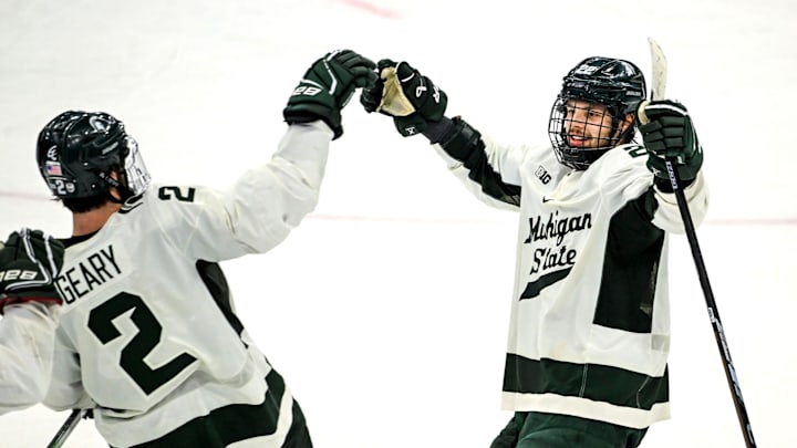 Michigan State's Isaac Howard, right, celebrates after his goal to win a shootout against Minnesota with teammate Patrick Geary, left, on Saturday, Jan. 25, 2025, at Munn Arena in East Lansing.