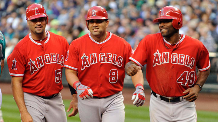 Aug 31, 2012; Seattle, WA, USA; Los Angeles Angels first baseman Albert Pujols (5) and designated hitter Kendrys Morales (8) and right fielder Torii Hunter (48) head back to the dugout after Morales hit a 3 run home run against the Seattle Mariners during the 1st inning at Safeco Field. Mandatory Credit: Steven Bisig-Imagn Images