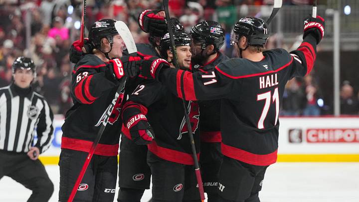 May 2, 2026; Raleigh, North Carolina, USA; Carolina Hurricanes center Logan Stankoven (22) is congratulated by left wing Taylor Hall (71) and right wing Jackson Blake (53) after his goal against the Philadelphia Flyers during the first period at Lenovo Center. Mandatory Credit: James Guillory-Imagn Images May 2, 2026; Raleigh, North Carolina, USA; Carolina Hurricanes center Logan Stankoven (22) is congratulated by left wing Taylor Hall (71) and right wing Jackson Blake (53) after his goal against the Philadelphia Flyers during the first period at Lenovo Center. Mandatory Credit: James Guillory-Imagn Images