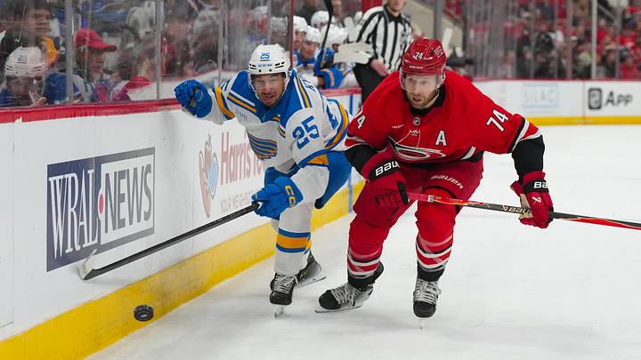 Mar 12, 2026; Raleigh, North Carolina, USA; Carolina Hurricanes defenseman Jaccob Slavin (74) and St. Louis Blues right wing Jordan Kyrou (25) watch the puck during the second period at Lenovo Center. Mandatory Credit: James Guillory-Imagn Images Mar 12, 2026; Raleigh, North Carolina, USA; Carolina Hurricanes defenseman Jaccob Slavin (74) and St. Louis Blues right wing Jordan Kyrou (25) watch the puck during the second period at Lenovo Center. Mandatory Credit: James Guillory-Imagn Images