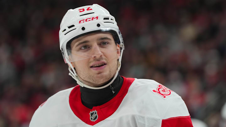 Dec 27, 2025; Raleigh, North Carolina, USA;  Detroit Red Wings center Marco Kasper (92) looks on against the Carolina Hurricanes during the first period at Lenovo Center. Mandatory Credit: James Guillory-Imagn Images