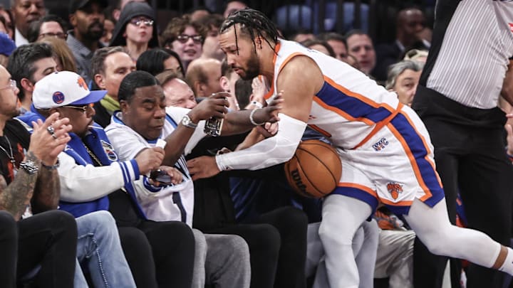 Nov 17, 2024; New York, New York, USA; New York Knicks guard Jalen Brunson (11) crashes into actor and comedian Tracy Morgan in the fourth quarter against the Brooklyn Nets at Madison Square Garden. Mandatory Credit: Wendell Cruz-Imagn Images Nov 17, 2024; New York, New York, USA; New York Knicks guard Jalen Brunson (11) crashes into actor and comedian Tracy Morgan in the fourth quarter against the Brooklyn Nets at Madison Square Garden. Mandatory Credit: Wendell Cruz-Imagn Images