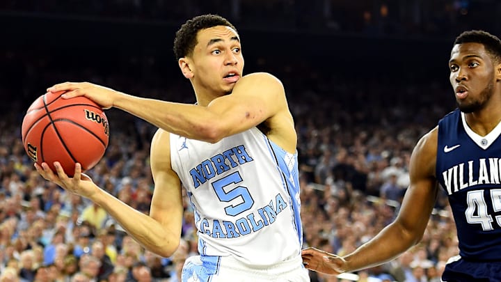 Apr 4, 2016; Houston, TX, USA; North Carolina Tar Heels guard Marcus Paige (5) handles the ball against Villanova Wildcats forward Darryl Reynolds (45) during the first half in the championship game of the 2016 NCAA Men's Final Four at NRG Stadium. Mandatory Credit: Bob Donnan-Imagn Images