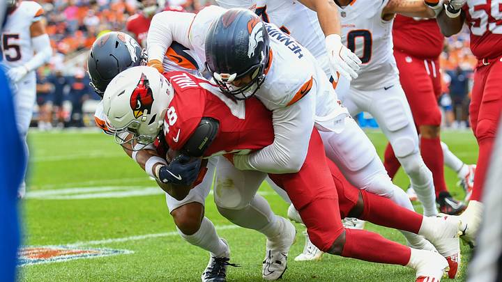 DENVER, CO - AUGUST 25: Arizona Cardinals running back Hassan Hall (48) is brought down by Denver Broncos defensive end Matt Henningsen (91). DENVER, CO - AUGUST 25: Arizona Cardinals running back Hassan Hall (48) is brought down by Denver Broncos defensive end Matt Henningsen (91).