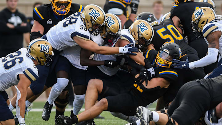 Montana State defense swarms to the football in a game against South Dakota State in 2023.