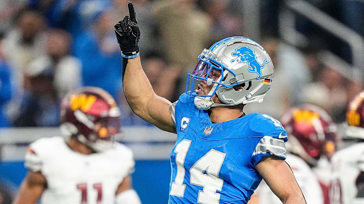 Detroit Lions wide receiver Amon-Ra St. Brown (14) celebrates a first down against Washington Commanders during the first half of the NFC divisional round at Ford Field in Detroit on Saturday, Jan. 18, 2025.