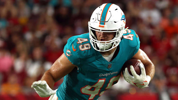 Miami Dolphins tight end Hayden Rucci (49) runs with the ball against the Tampa Bay Buccaneers during the second half at Raymond James Stadium in the 2024 preseason. Miami Dolphins tight end Hayden Rucci (49) runs with the ball against the Tampa Bay Buccaneers during the second half at Raymond James Stadium in the 2024 preseason.