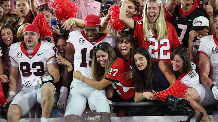 Georgia Bulldogs fans celebrate the 24-20 win over the Florida Gators by dragging players up into the stands after the second half of an NCAA football game at Everbank Stadium in Jacksonville, FL on Saturday, November 1, 2025. Georgia won 24-20. [Alan Youngblood/Gainesville Sun]