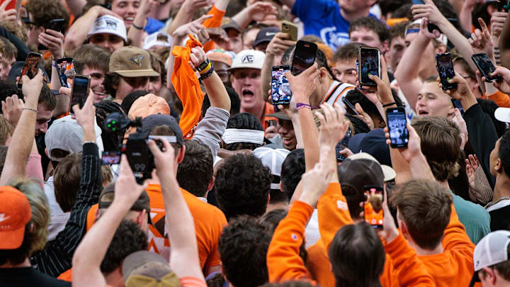 Feb 25, 2025; Stillwater, Oklahoma, USA; Oklahoma State Cowboys fans storm the court to celebrate after the game against the Iowa State Cyclones at Gallagher-Iba Arena. Mandatory Credit: William Purnell-Imagn Images Feb 25, 2025; Stillwater, Oklahoma, USA; Oklahoma State Cowboys fans storm the court to celebrate after the game against the Iowa State Cyclones at Gallagher-Iba Arena. Mandatory Credit: William Purnell-Imagn Images