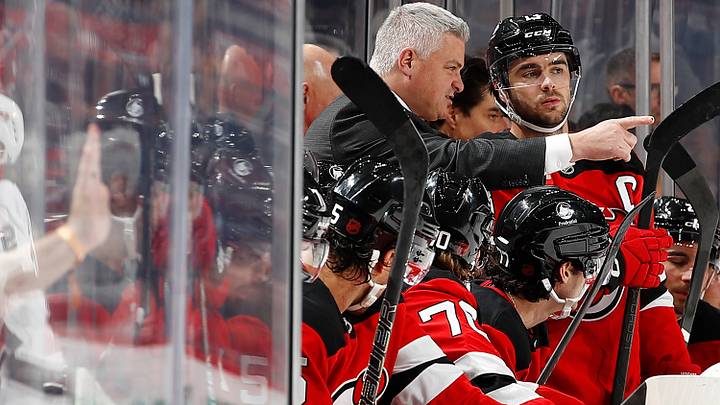 Sheldon Keefe speaks to Nico Hischier of the New Jersey Devils