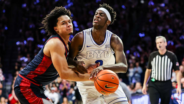 Feb 18, 2026; Tucson, Arizona, USA; Brigham Young Cougars forward AJ Dybantsa (3) dribbles the ball while Arizona Wildcats guard Brayden Burries (5) attempts to block him during the first half of the game at McKale Memorial Center. Mandatory Credit: Aryanna Frank-Imagn Images