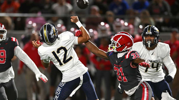 Mater Dei 4-star linebacker Nasir Wyatt with a big hit on St. John Bosco freshman QB Koa Malau’ulu, during a surprising 59-14 lopsided victory over St. John Bosco at Santa Ana Stadium on Oct. 25. 