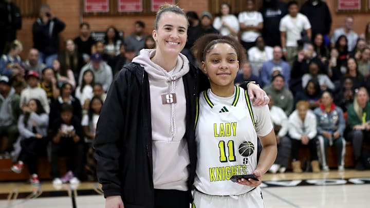 Sabrina Ionescu poses with Ontario Christian sophomore Kaleena Smith, the game's MVP after she scored 23 points in a 61-44 win over Mitty on Jan. 4 at Carondelet High School in Concord, Calif. 