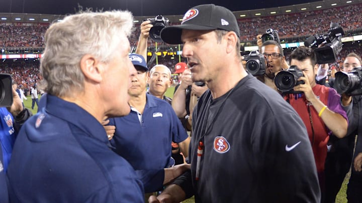 Seattle Seahawks coach Pete Carroll shakes hands with San Francisco 49ers coach Jim Harbaugh after the game at Candlestick Park. The 49ers defeated the Seahawks 13-6.  