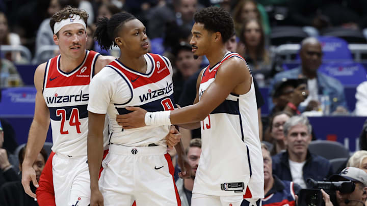 Oct 30, 2024; Washington, District of Columbia, USA; Washington Wizards guard Bub Carrington (8) is restrained by Wizards guard Jordan Poole (13) after being hard fouled by Atlanta Hawks guard Garrison Mathews (not pictured) in the first half at Capital One Arena. Mandatory Credit: Geoff Burke-Imagn Images Oct 30, 2024; Washington, District of Columbia, USA; Washington Wizards guard Bub Carrington (8) is restrained by Wizards guard Jordan Poole (13) after being hard fouled by Atlanta Hawks guard Garrison Mathews (not pictured) in the first half at Capital One Arena. Mandatory Credit: Geoff Burke-Imagn Images