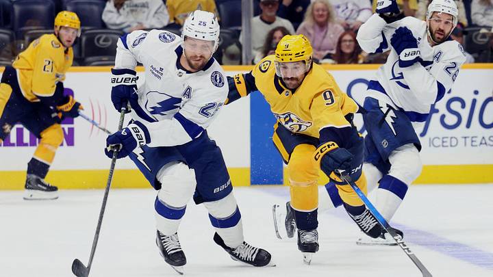 Sep 22, 2026; Nashville, Tennessee, USA; Tampa Bay Lightning left wing Jeffrey Viel (25) and Nashville Predators left wing Filip Forsberg (9) battle for the puck during the third period at Bridgestone Arena. Mandatory Credit: Alan Poizner-Imagn Images Sep 22, 2026; Nashville, Tennessee, USA; Tampa Bay Lightning left wing Jeffrey Viel (25) and Nashville Predators left wing Filip Forsberg (9) battle for the puck during the third period at Bridgestone Arena. Mandatory Credit: Alan Poizner-Imagn Images