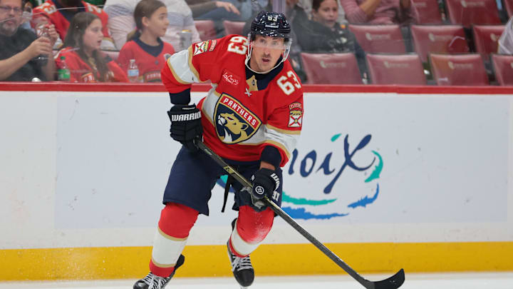 Nov 1, 2025; Sunrise, Florida, USA; Florida Panthers left wing Brad Marchand (63) moves the puck against the Dallas Stars during the second period at Amerant Bank Arena. Mandatory Credit: Sam Navarro-Imagn Images