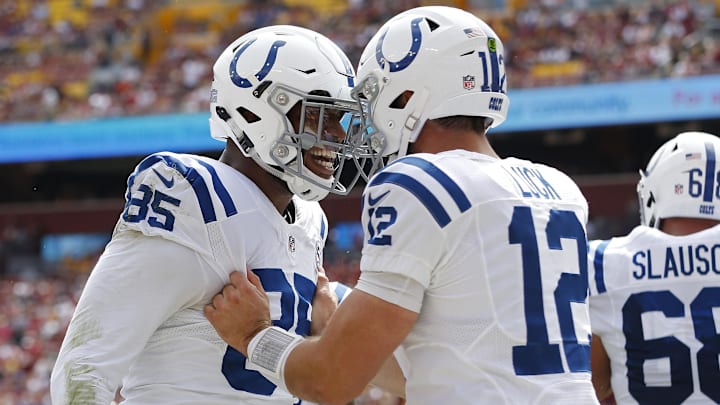 Sep 16, 2018; Landover, MD, USA; Indianapolis Colts tight end Eric Ebron (85) celebrates with Colts quarterback Andrew Luck (12) after connecting on a touchdown pass against the Washington Redskins in the first quarter at FedEx Field.