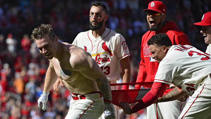 Sep 22, 2018; St. Louis, MO, USA; St. Louis Cardinals right fielder Tyler O'Neill (41) has his uniform ripped off by second baseman Yairo Munoz (34) as they celebrate after O'Neil hit a walk off solo home run off of San Francisco Giants relief pitcher Mark Melancon (not pictured) during the tenth inning at Busch Stadium. Mandatory Credit: Jeff Curry-Imagn Images Sep 22, 2018; St. Louis, MO, USA; St. Louis Cardinals right fielder Tyler O'Neill (41) has his uniform ripped off by second baseman Yairo Munoz (34) as they celebrate after O'Neil hit a walk off solo home run off of San Francisco Giants relief pitcher Mark Melancon (not pictured) during the tenth inning at Busch Stadium. Mandatory Credit: Jeff Curry-Imagn Images