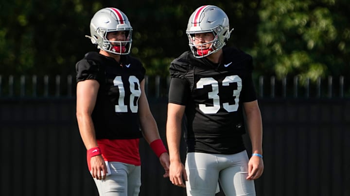 Ohio State Buckeyes quarterback Devin Brown (33) and quarterback Will Howard (18)