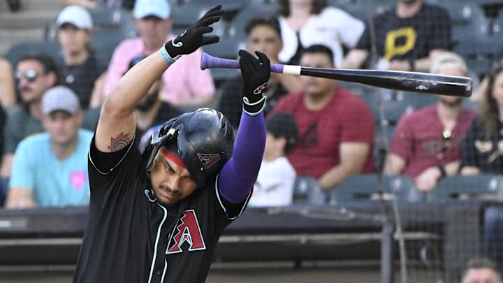 Jun 23, 2025; Chicago, Illinois, USA;  Arizona Diamondbacks first base Josh Naylor (22) losses his bat during the first inning against the Chicago White Sox at Rate Field. Mandatory Credit: Matt Marton-Imagn Images