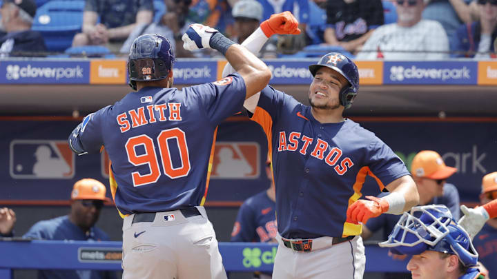Mar 16, 2025; Port St. Lucie, Florida, USA;  Houston Astros catcher Yainer Diaz (21) and right fielder Cam Smith (90) celebrate after scoring on a two run home run.