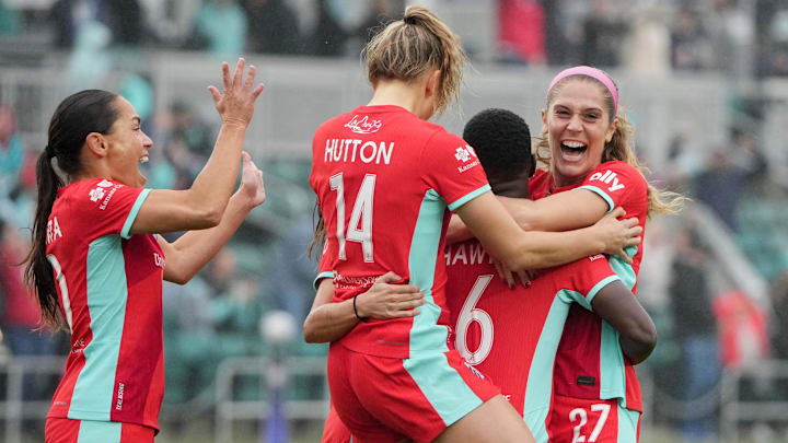 Kansas City Current forward Temwa Chawinga (6) celebrates with defender Kayla Sharples (27) after scoring a goal against the North Carolina Courage in a NWSL playoff match at CPKC Stadium