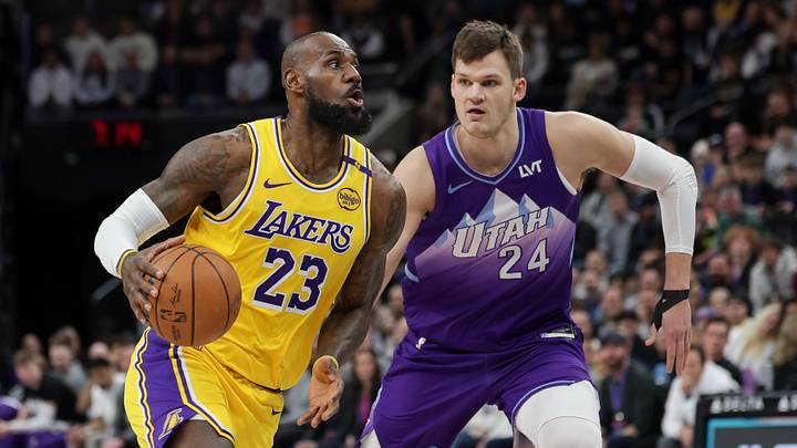 Feb 12, 2025; Salt Lake City, Utah, USA;  Los Angeles Lakers forward LeBron James (23) dribbles past Utah Jazz center Walker Kessler (24) during the first quarter at Delta Center. Mandatory Credit: Chris Nicoll-Imagn Images
