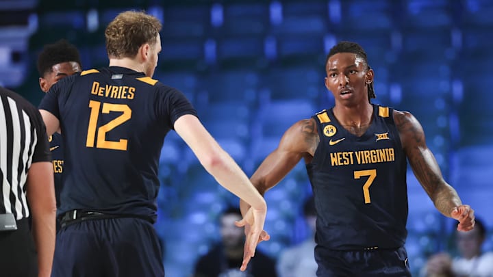 Nov 28, 2024; Paradise Island, Bahamas, BHS; West Virginia Mountaineers guard Javon Small (7) celebrates with West Virginia Mountaineers guard Javon Small (7) after scoring during the first half against the Louisville Cardinals at Imperial Arena at the Atlantis resort.  